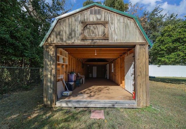 view of outbuilding with a yard