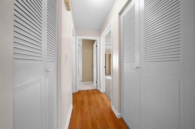 hall featuring light hardwood / wood-style flooring