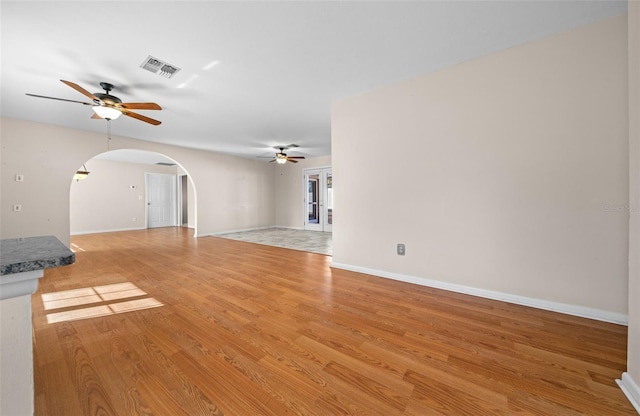 unfurnished living room with light hardwood / wood-style floors and ceiling fan