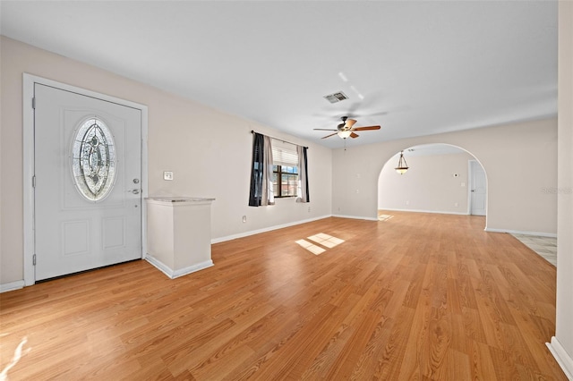 entrance foyer with ceiling fan and light hardwood / wood-style flooring