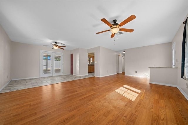 unfurnished living room with light hardwood / wood-style floors and ceiling fan