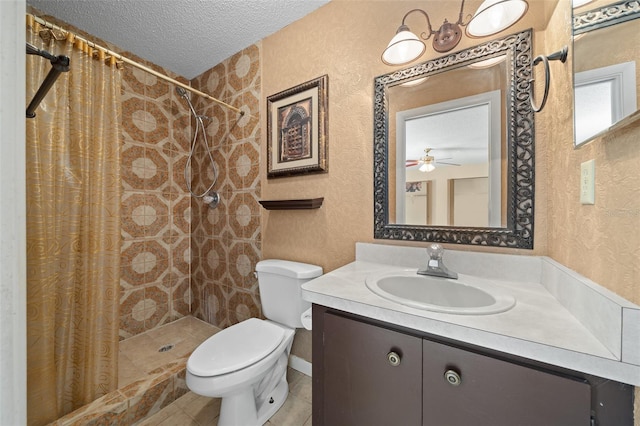 bathroom with curtained shower, tile patterned floors, a textured ceiling, toilet, and vanity