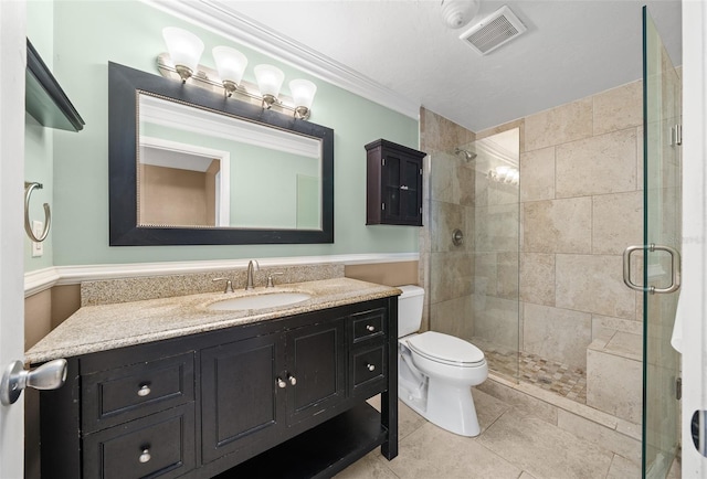 bathroom with vanity, tile patterned floors, toilet, ornamental molding, and a shower with shower door