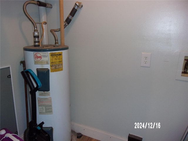 utility room featuring water heater