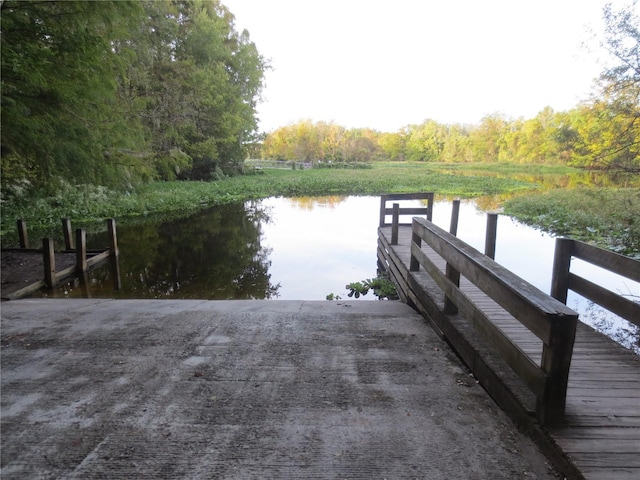 view of dock with a water view