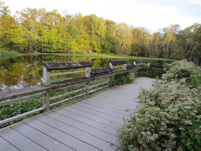 wooden deck featuring a water view