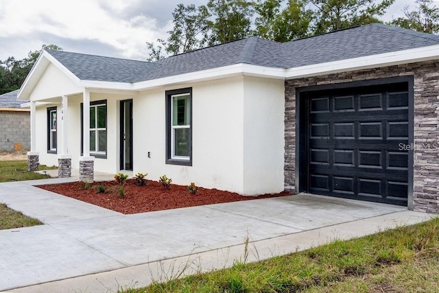 view of front of house with a porch and a garage