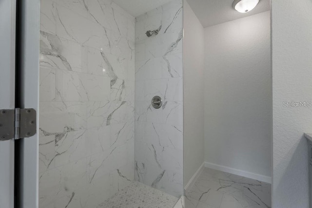 bathroom featuring tiled shower