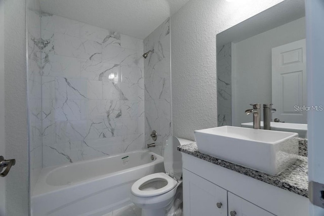 full bathroom with washtub / shower combination, a textured ceiling, vanity, and toilet