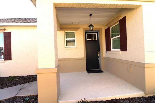 9871 SW 99th Loop, Ocala, FL 34481 - entrance to property featuring stucco siding