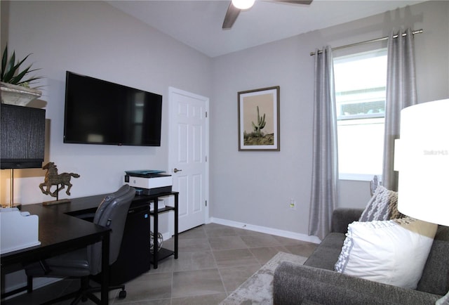 office space with ceiling fan and light tile patterned floors