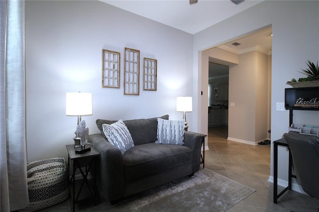 tiled living room featuring ornamental molding