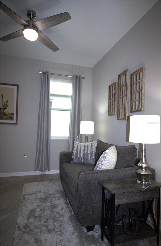 tiled living room featuring ceiling fan