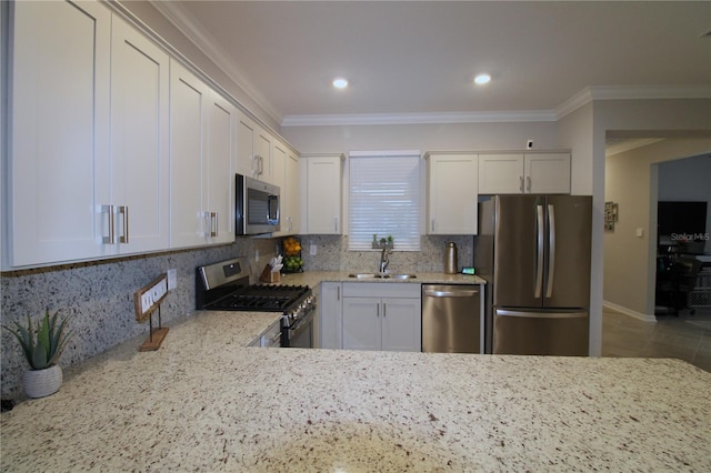 9871 SW 99th Loop, Ocala, FL 34481 - kitchen featuring stainless steel appliances, crown molding, tasteful backsplash, light stone countertops, and recessed lighting