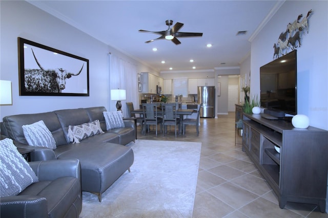 living room featuring ceiling fan and crown molding