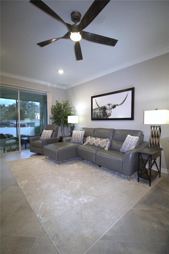 living room with tile patterned flooring, ceiling fan, and ornamental molding