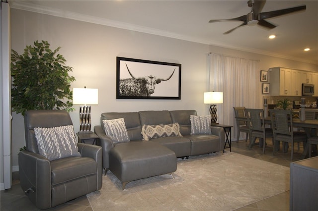 tiled living room featuring ceiling fan and crown molding