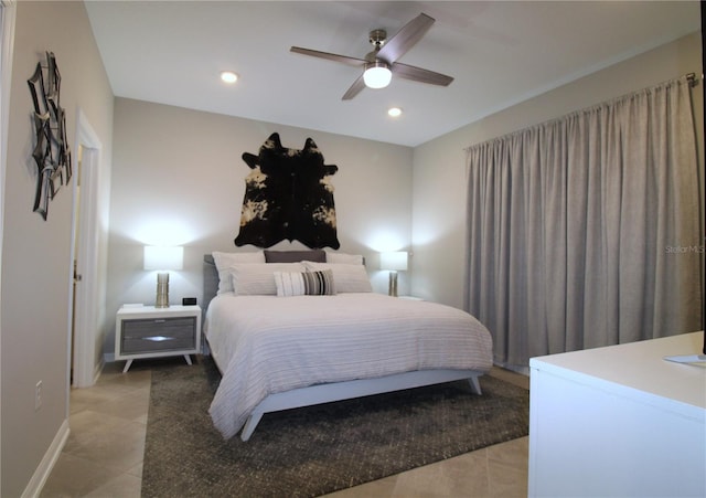 bedroom featuring ceiling fan and light tile patterned floors