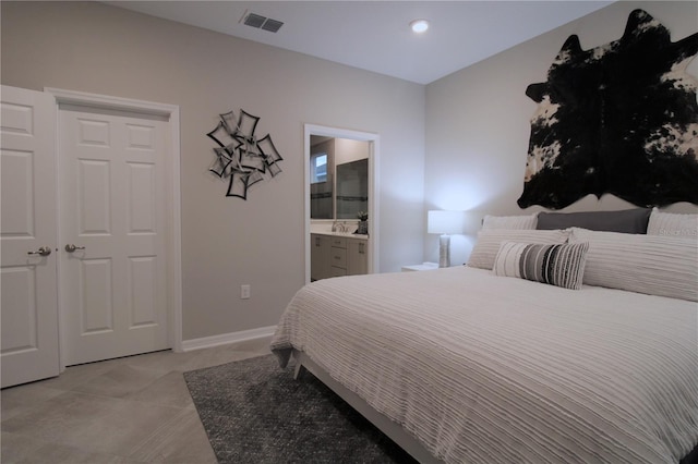 bedroom featuring ensuite bath