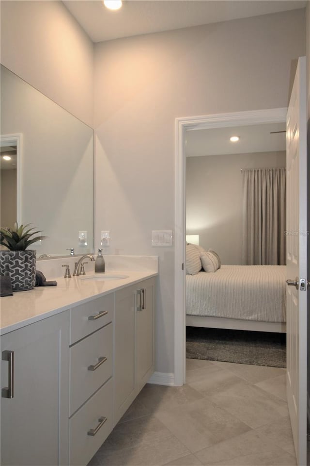 bathroom with vanity and tile patterned floors