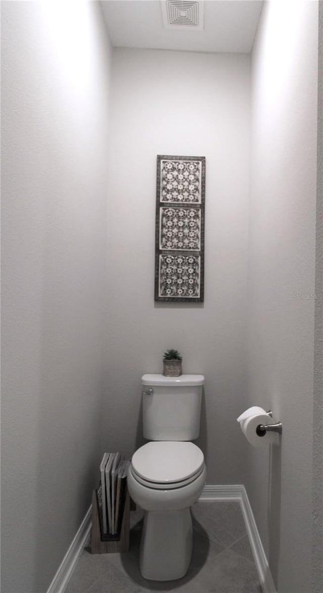 bathroom featuring tile patterned floors and toilet