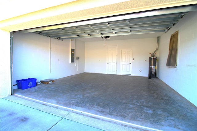 garage with electric panel, gas water heater, and a garage door opener