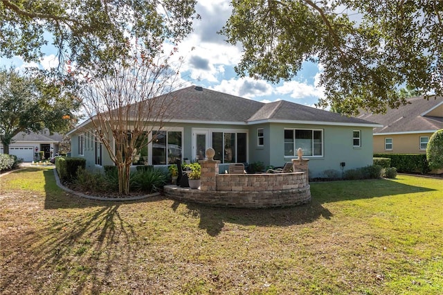 rear view of property with a yard