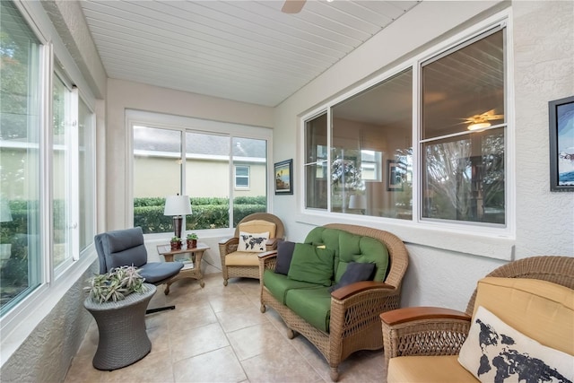 sunroom featuring ceiling fan