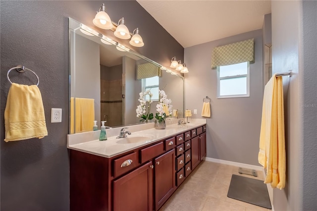 bathroom with tile patterned floors and vanity