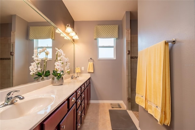 bathroom with tile patterned flooring, vanity, and walk in shower