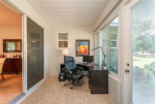 office space with light tile patterned flooring