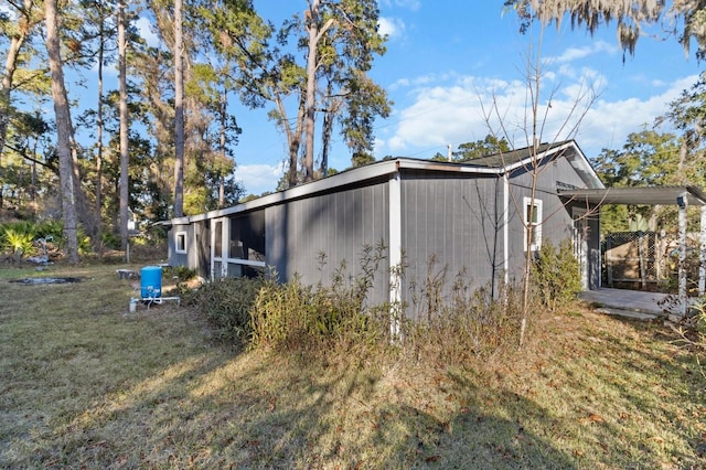 view of property exterior with a lawn