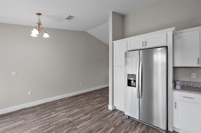 kitchen featuring white cabinetry, stainless steel fridge with ice dispenser, a chandelier, lofted ceiling, and wood-type flooring