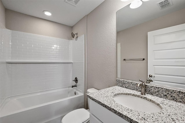 full bathroom with bathtub / shower combination, vanity, and toilet