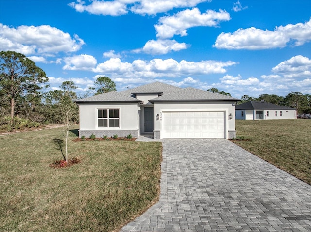 view of front facade with a front yard and a garage