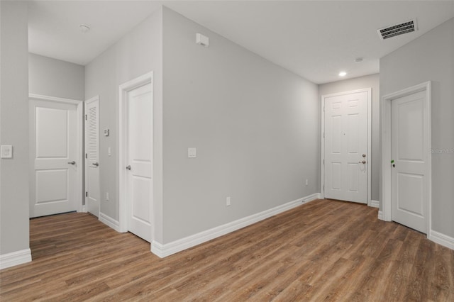 spare room featuring dark wood-type flooring