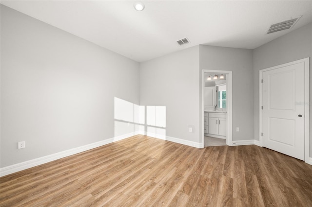 spare room featuring hardwood / wood-style flooring