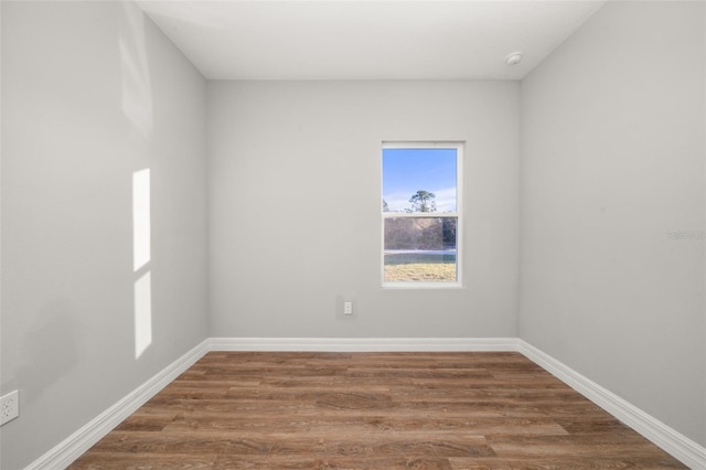 empty room featuring wood-type flooring