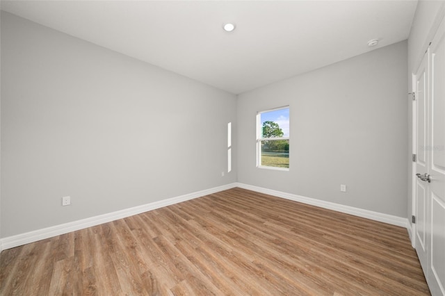 spare room with light hardwood / wood-style floors