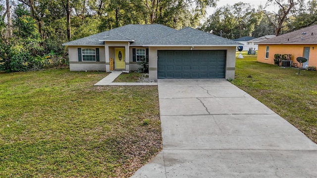 ranch-style house featuring a front yard, central AC, and a garage