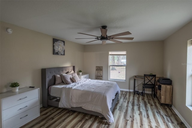 bedroom featuring ceiling fan and light hardwood / wood-style floors