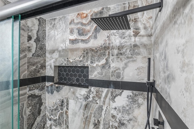 details featuring a tile shower