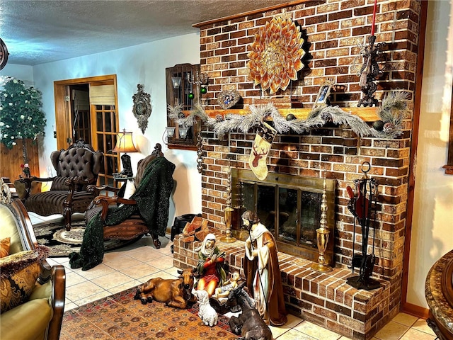 tiled living room with a textured ceiling and a brick fireplace