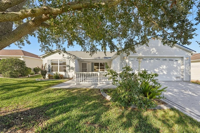 view of front of house with a front yard, a porch, and a garage