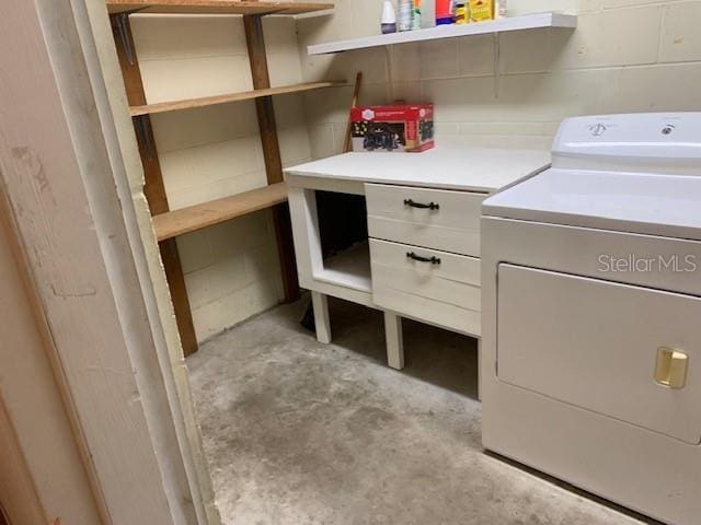 clothes washing area with separate washer and dryer