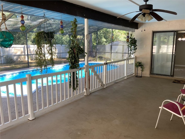 view of pool with ceiling fan and a patio area