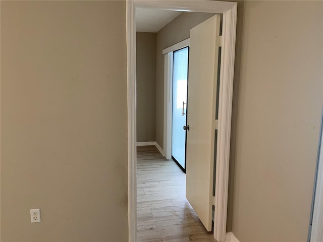 corridor featuring light hardwood / wood-style floors