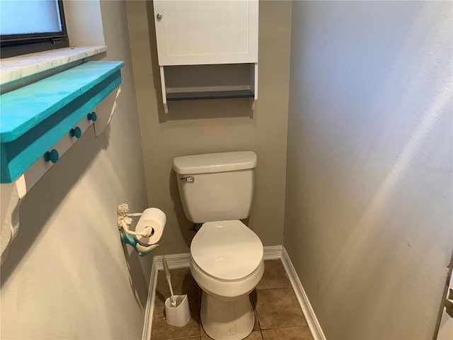 bathroom featuring tile patterned floors and toilet