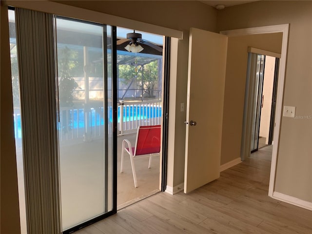 entryway with ceiling fan and light hardwood / wood-style floors