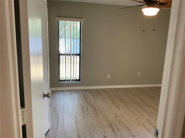 spare room featuring ceiling fan and light wood-type flooring